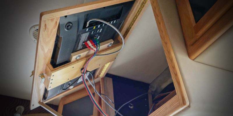 Front overhead TV cabinet mount internal wiring